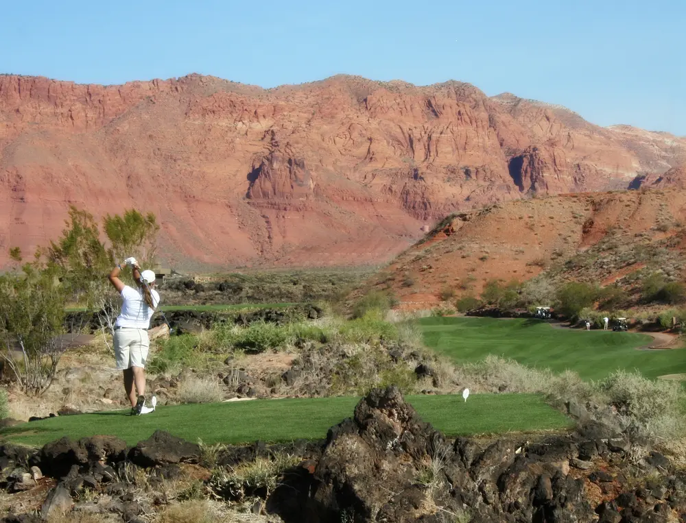 golfer on a desert golf course in Utah Find Sunbrook Golf Homes For Sale